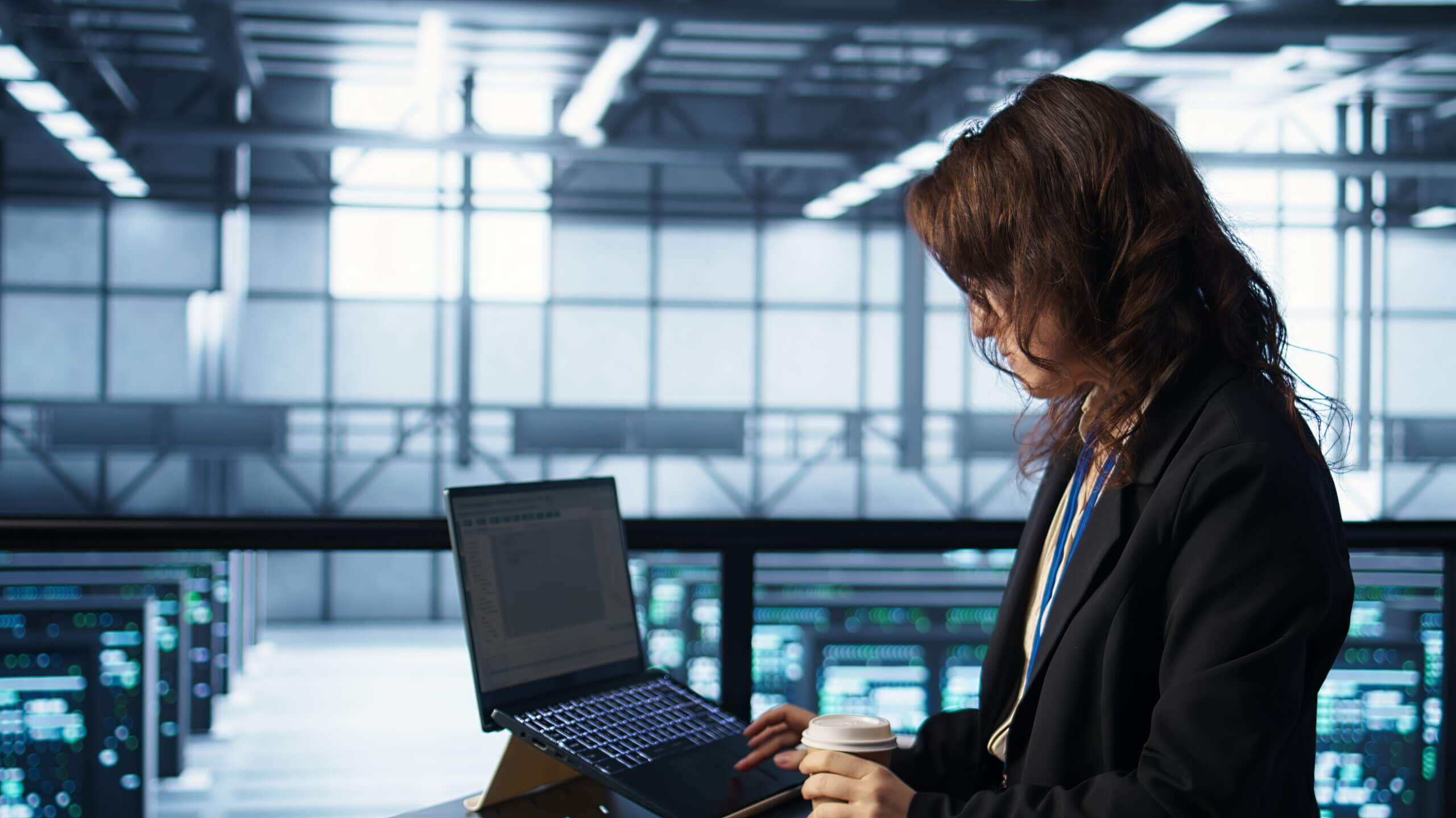 technician using laptop data center finetuning network protocols scaled - marketingmedia